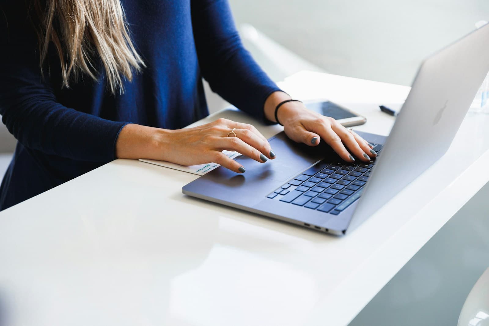 Staff member working remotely on a laptop